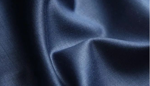 What are the causes of stains and spots on the fabric?
