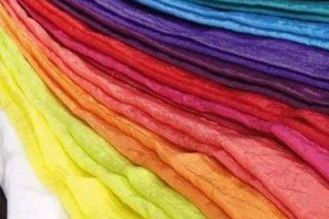 What is the role of penetrants in dyeing and finishing?
